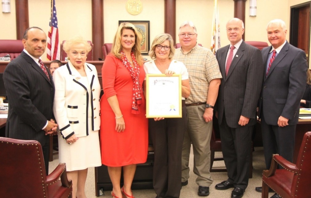 The Monmouth County Board of Chosen Freeholders present a proclamation declaring “Charcot-Marie-Tooth (CMT) Awareness Month” in Monmouth County to Central NJ CMT Support and Action Group Co-Facilitator Jacky Donahue and Facilitator Mark Willis on Sept. 11, 2014 in Freehold, NJ. Pictured left to right: Freeholder Thomas A. Arnone, Freeholder Lillian G. Burry, Freeholder Serena DiMaso, Jacky Donahue, Mark Willis, Freeholder Deputy Director Gary J. Rich, Sr. and Freeholder John P. Curley.